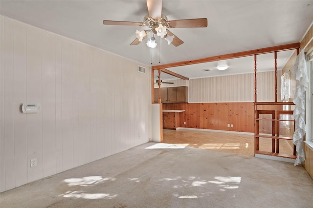 10230 Kilkenny Pl, Dallas, TX 75228 - empty room featuring ceiling fan, carpet flooring, and wood walls
