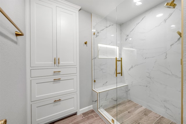 7909 Quest Ct, Frisco, TX 75035 - bathroom with a marble finish shower and wood finish floors