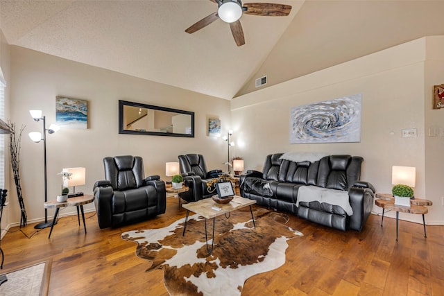 7909 Quest Ct, Frisco, TX 75035 - living room featuring a ceiling fan, hardwood / wood-style floors, and high vaulted ceiling