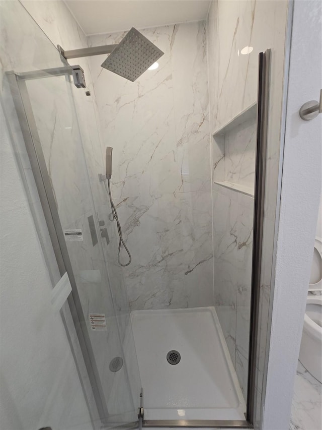 5323 Dazzle Dr, Dallas, TX 75232 - full bathroom with a marble finish shower and marble look tile flooring