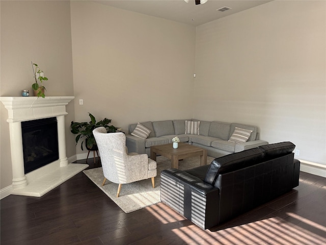 3323 Royal Ridge Dr, Rockwall, TX 75087 - living area with wood finished floors and a glass covered fireplace