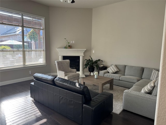 3323 Royal Ridge Dr, Rockwall, TX 75087 - living room with ceiling fan, a fireplace, plenty of natural light, and dark wood-style floors
