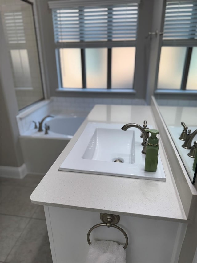 3323 Royal Ridge Dr, Rockwall, TX 75087 - bathroom with vanity, tile patterned flooring, and a tub to relax in