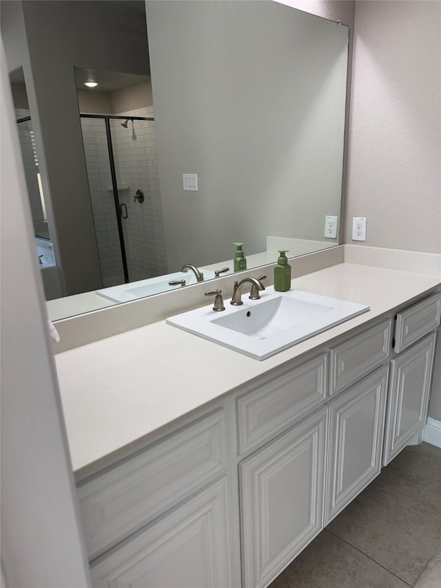 3323 Royal Ridge Dr, Rockwall, TX 75087 - bathroom featuring vanity, a shower stall, and tile patterned flooring