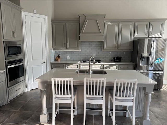 3323 Royal Ridge Dr, Rockwall, TX 75087 - kitchen with stainless steel appliances, premium range hood, decorative backsplash, and light countertops