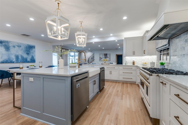 7402 Centenary Ave, Dallas, TX 75225 - kitchen with dishwasher, premium range hood, range with two ovens, a chandelier, and decorative backsplash