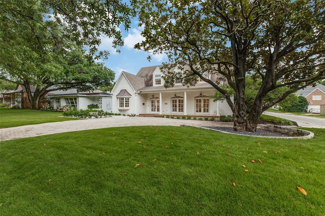 7402 Centenary Ave, Dallas, TX 75225 - view of front of property with curved driveway, a front yard, and a ceiling fan