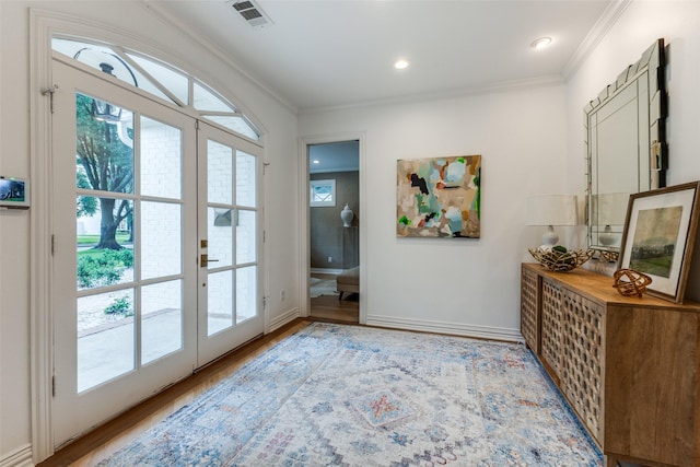 7402 Centenary Ave, Dallas, TX 75225 - doorway with ornamental molding, wood finished floors, french doors, and recessed lighting