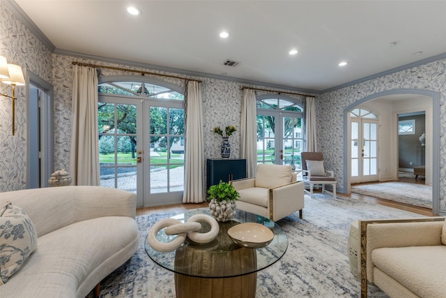 7402 Centenary Ave, Dallas, TX 75225 - living area with french doors, wallpapered walls, ornamental molding, wood finished floors, and arched walkways