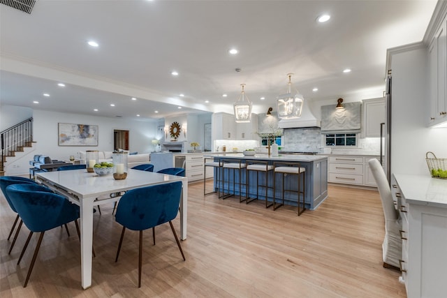 7402 Centenary Ave, Dallas, TX 75225 - dining area with recessed lighting, light wood finished floors, and stairs