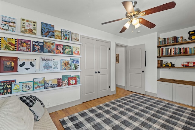 7516 Deaver Dr, North Richland Hills, TX 76180 - living area with light wood-style flooring and a ceiling fan