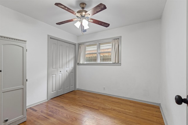 7516 Deaver Dr, North Richland Hills, TX 76180 - unfurnished bedroom with light wood-style floors, a closet, and a ceiling fan