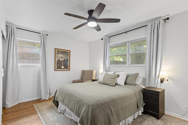 7516 Deaver Dr, North Richland Hills, TX 76180 - bedroom featuring wood finished floors and ceiling fan
