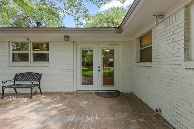 7516 Deaver Dr, North Richland Hills, TX 76180 - property entrance featuring french doors, brick siding, and a patio area