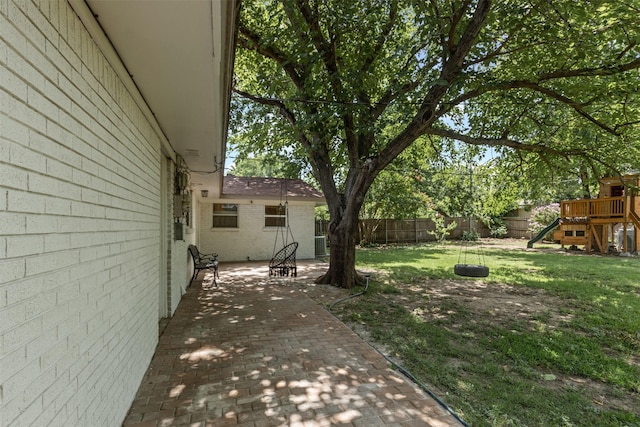 7516 Deaver Dr, North Richland Hills, TX 76180 - fenced backyard with a playground and a patio area