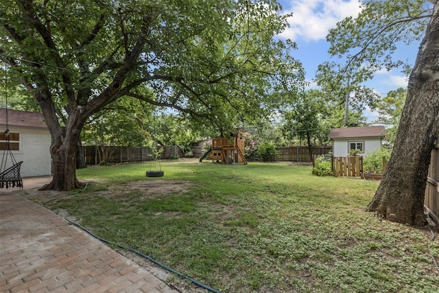7516 Deaver Dr, North Richland Hills, TX 76180 - fenced backyard with a playground and a patio area