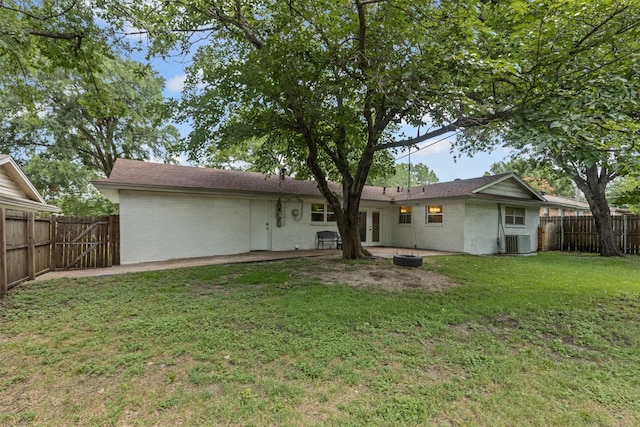 7516 Deaver Dr, North Richland Hills, TX 76180 - back of house with brick siding, french doors, and a fenced backyard