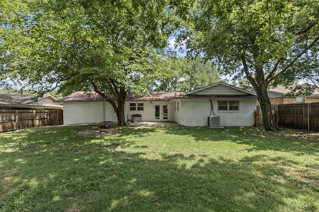 7516 Deaver Dr, North Richland Hills, TX 76180 - back of house featuring french doors, a fenced backyard, and brick siding