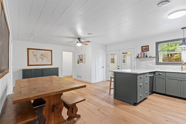 7516 Deaver Dr, North Richland Hills, TX 76180 - dining area with light wood-type flooring, a ceiling fan, french doors, and crown molding