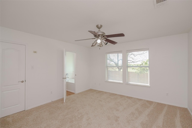 2912 Lighthouse Dr, Denton, TX 76210 - spare room featuring light carpet and ceiling fan
