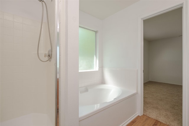 2912 Lighthouse Dr, Denton, TX 76210 - bathroom with a stall shower, a garden tub, and wood finished floors