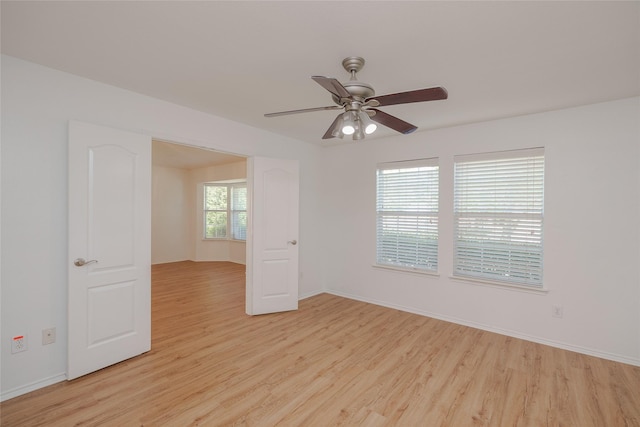 2912 Lighthouse Dr, Denton, TX 76210 - unfurnished room with light wood finished floors and a ceiling fan