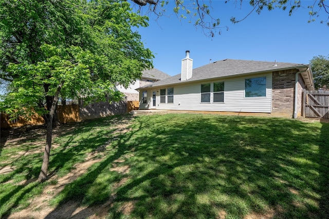 2912 Lighthouse Dr, Denton, TX 76210 - rear view of property featuring a fenced backyard, a chimney, brick siding, and roof with shingles
