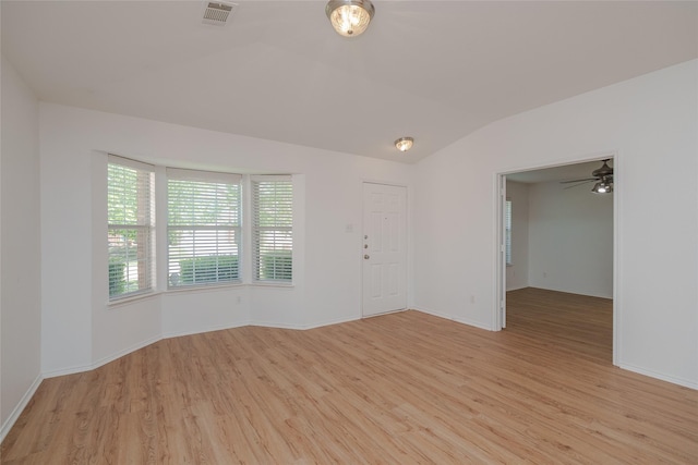 2912 Lighthouse Dr, Denton, TX 76210 - empty room with light wood finished floors, vaulted ceiling, and a ceiling fan