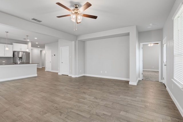 724 Cromane Rd, Fort Worth, TX 76052 - unfurnished living room with a ceiling fan, light wood-style flooring, and recessed lighting
