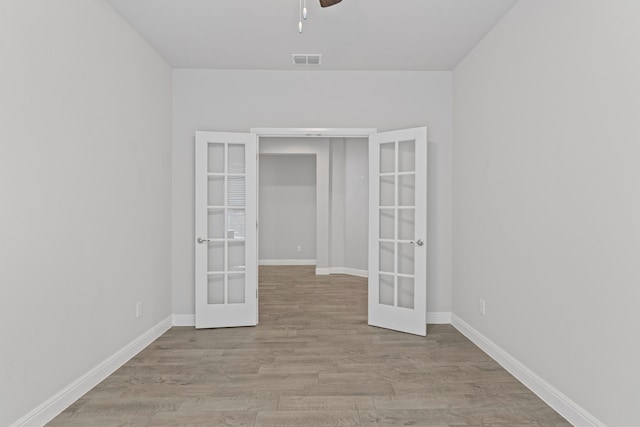 724 Cromane Rd, Fort Worth, TX 76052 - unfurnished room with french doors, a ceiling fan, and wood finished floors