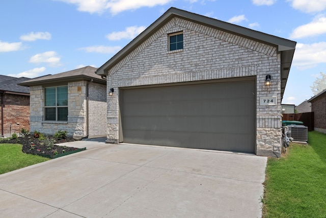 724 Cromane Rd, Fort Worth, TX 76052 - single story home featuring a garage, stone siding, concrete driveway, and a front yard