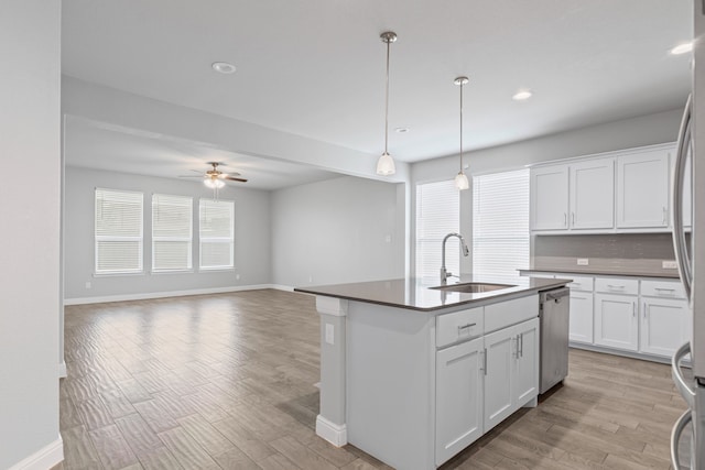 724 Cromane Rd, Fort Worth, TX 76052 - kitchen featuring dishwasher, light wood-type flooring, a ceiling fan, white cabinetry, and dark countertops