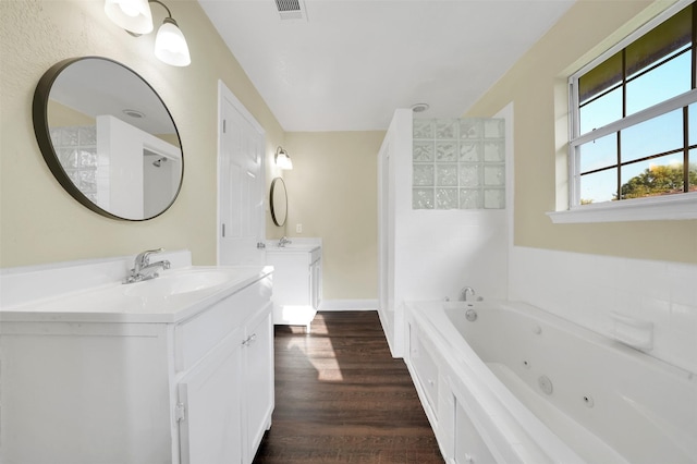 1724 Lincolnshire Way, Fort Worth, TX 76134 - full bath with vanity, a jetted tub, and wood finished floors