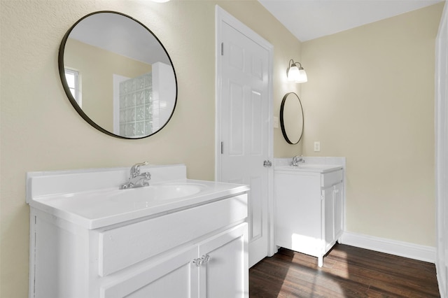 1724 Lincolnshire Way, Fort Worth, TX 76134 - bathroom featuring two vanities and wood finished floors