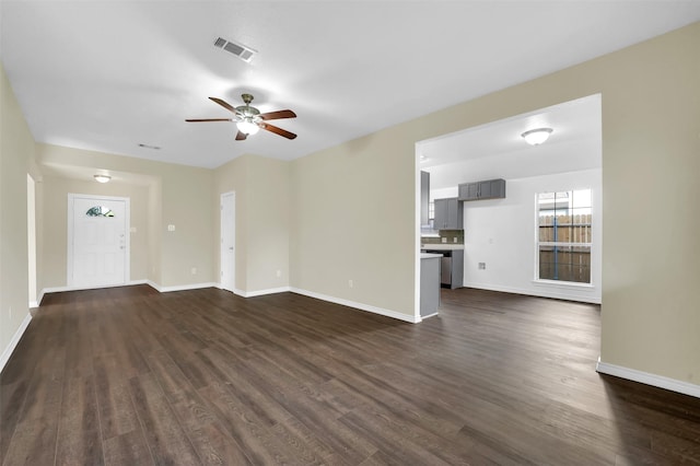 1724 Lincolnshire Way, Fort Worth, TX 76134 - unfurnished living room with dark wood-type flooring and a ceiling fan