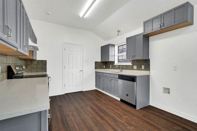 1724 Lincolnshire Way, Fort Worth, TX 76134 - kitchen with stainless steel dishwasher, lofted ceiling, gray cabinets, dark wood-type flooring, and under cabinet range hood