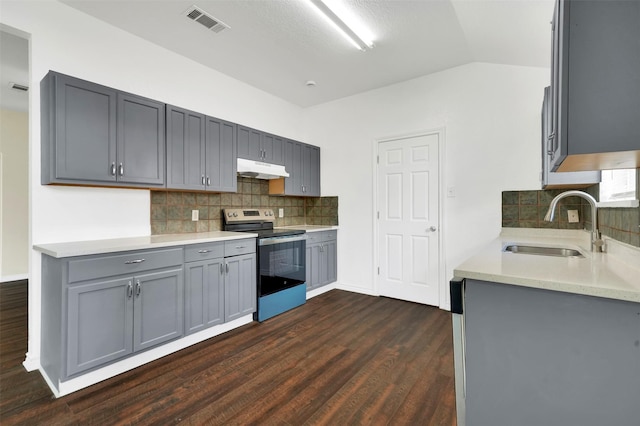 1724 Lincolnshire Way, Fort Worth, TX 76134 - kitchen featuring stainless steel range with electric cooktop, gray cabinets, dark wood-style flooring, under cabinet range hood, and lofted ceiling