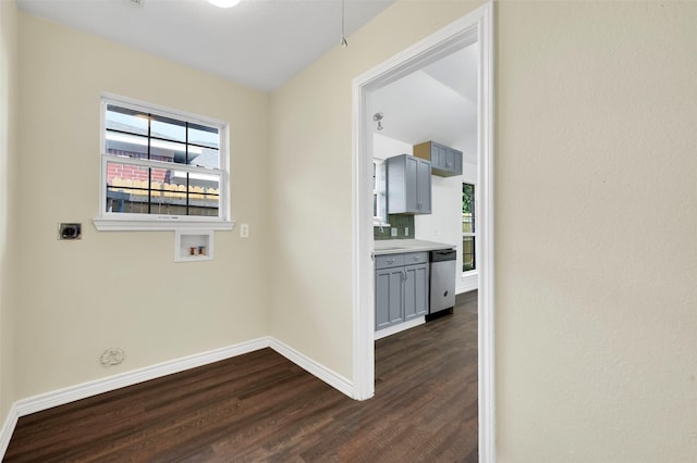 1724 Lincolnshire Way, Fort Worth, TX 76134 - laundry area with electric dryer hookup, dark wood finished floors, and washer hookup