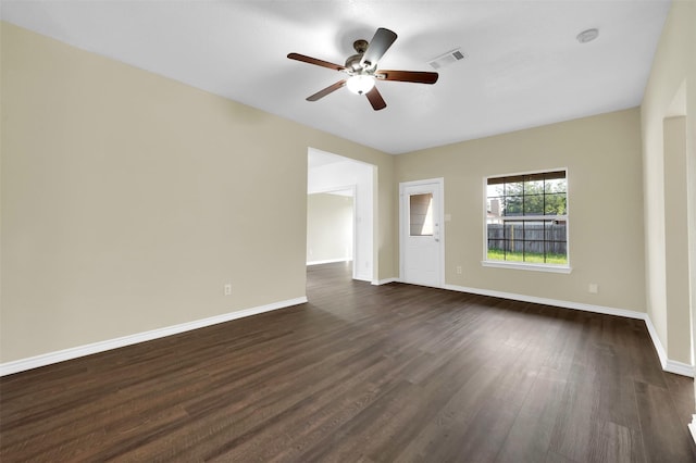 1724 Lincolnshire Way, Fort Worth, TX 76134 - empty room with dark wood-style flooring and a ceiling fan