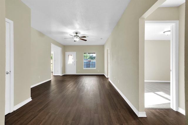 1724 Lincolnshire Way, Fort Worth, TX 76134 - unfurnished living room featuring ceiling fan and dark wood-style floors