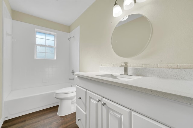 1724 Lincolnshire Way, Fort Worth, TX 76134 - bathroom featuring vanity, wood finished floors, and washtub / shower combination
