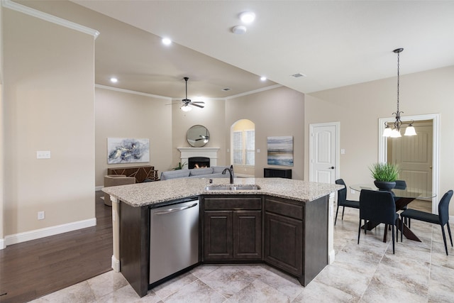 1809 Camo Ct, Allen, TX 75002 - kitchen with dishwasher, a ceiling fan, a warm lit fireplace, a kitchen island with sink, and crown molding