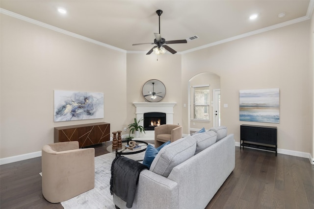 1809 Camo Ct, Allen, TX 75002 - living room featuring ceiling fan, a lit fireplace, dark wood-style floors, ornamental molding, and recessed lighting