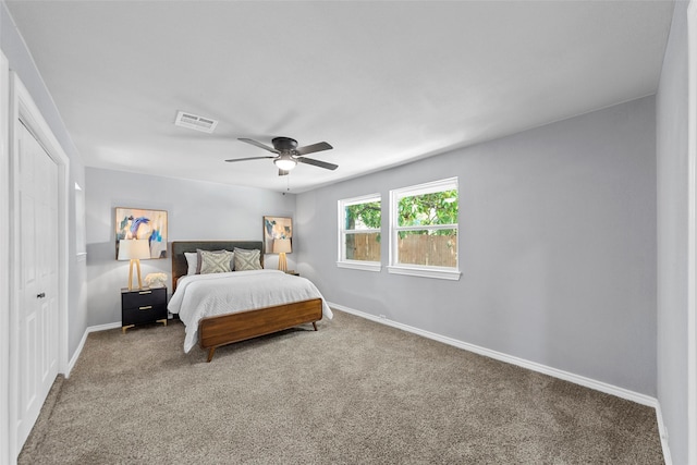 2473 W Five Mile Pkwy, Dallas, TX 75233 - carpeted bedroom featuring a closet and ceiling fan