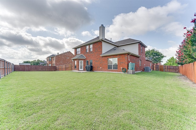 1684 Tannerson Dr, Rockwall, TX 75087 - back of house with brick siding, a chimney, a fenced backyard, and roof with shingles