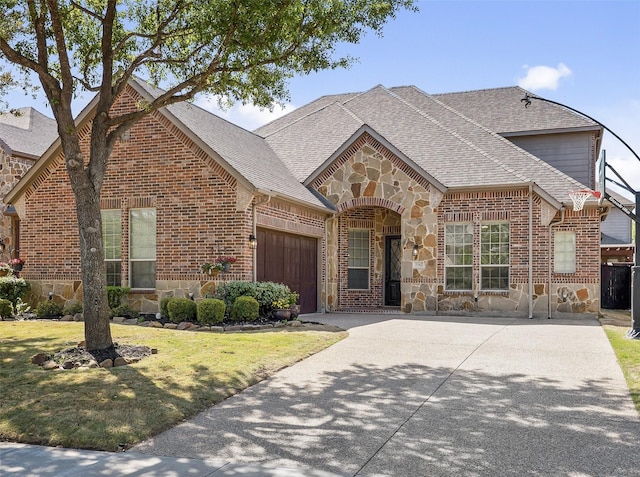 2542 Morgan Ln, Trophy Club, TX 76262 - french provincial home featuring stone siding, a shingled roof, a garage, and concrete driveway