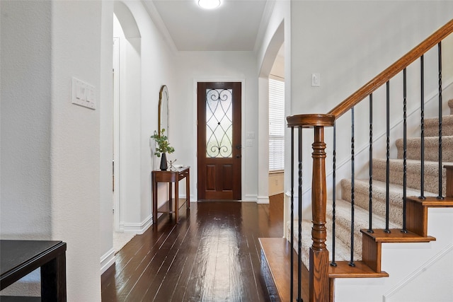 2542 Morgan Ln, Trophy Club, TX 76262 - foyer featuring arched walkways, hardwood / wood-style flooring, crown molding, and stairway