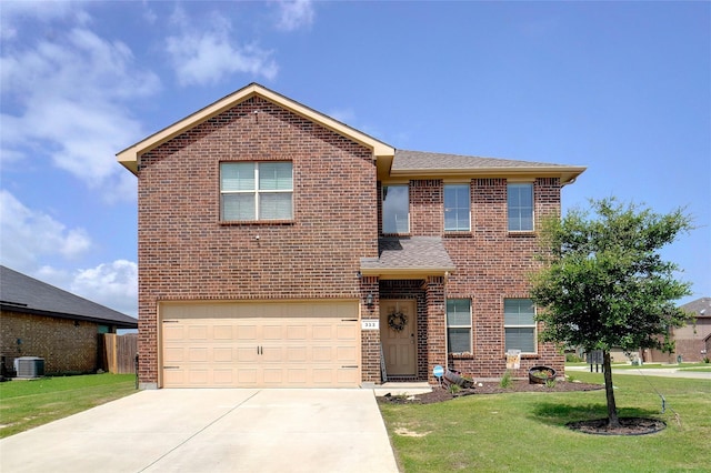 322 Chestnut Ln, Ponder, TX 76259 - traditional-style home featuring brick siding, a front yard, a garage, and concrete driveway