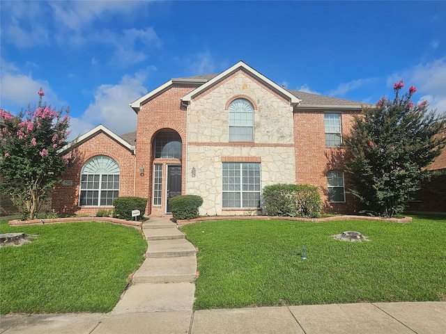 7101 Bickers Dr, Rowlett, TX 75089 - view of front of property featuring a front lawn, brick siding, and stone siding