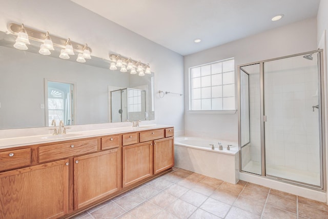 7101 Bickers Dr, Rowlett, TX 75089 - bathroom with a shower stall, a bath, double vanity, and recessed lighting